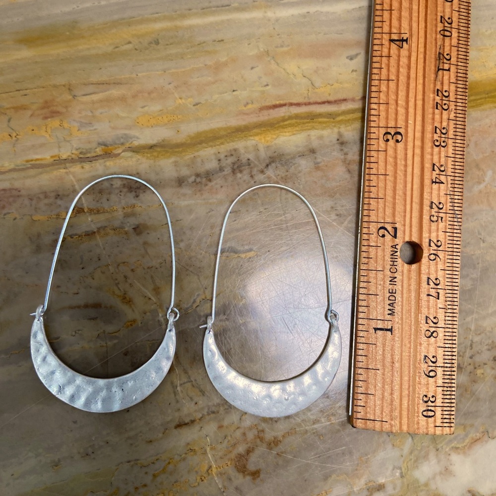 Handmade item, hammered, allergy free plated silver, locking latch back.